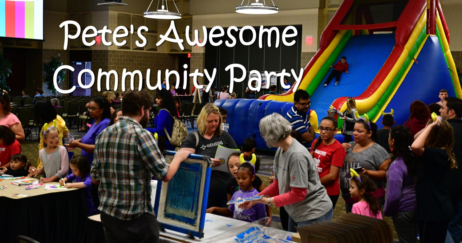 Photo showing families inside with tables and an inflatable slide