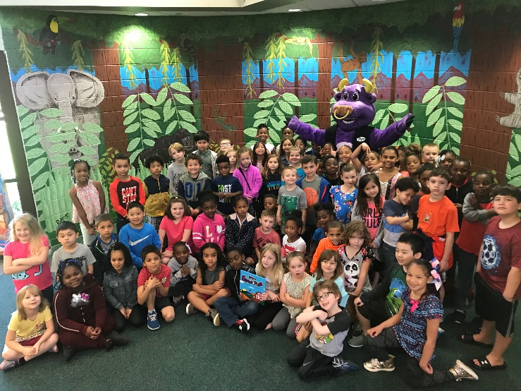 Pete the Bull posing with children at Fillmore Elementary School