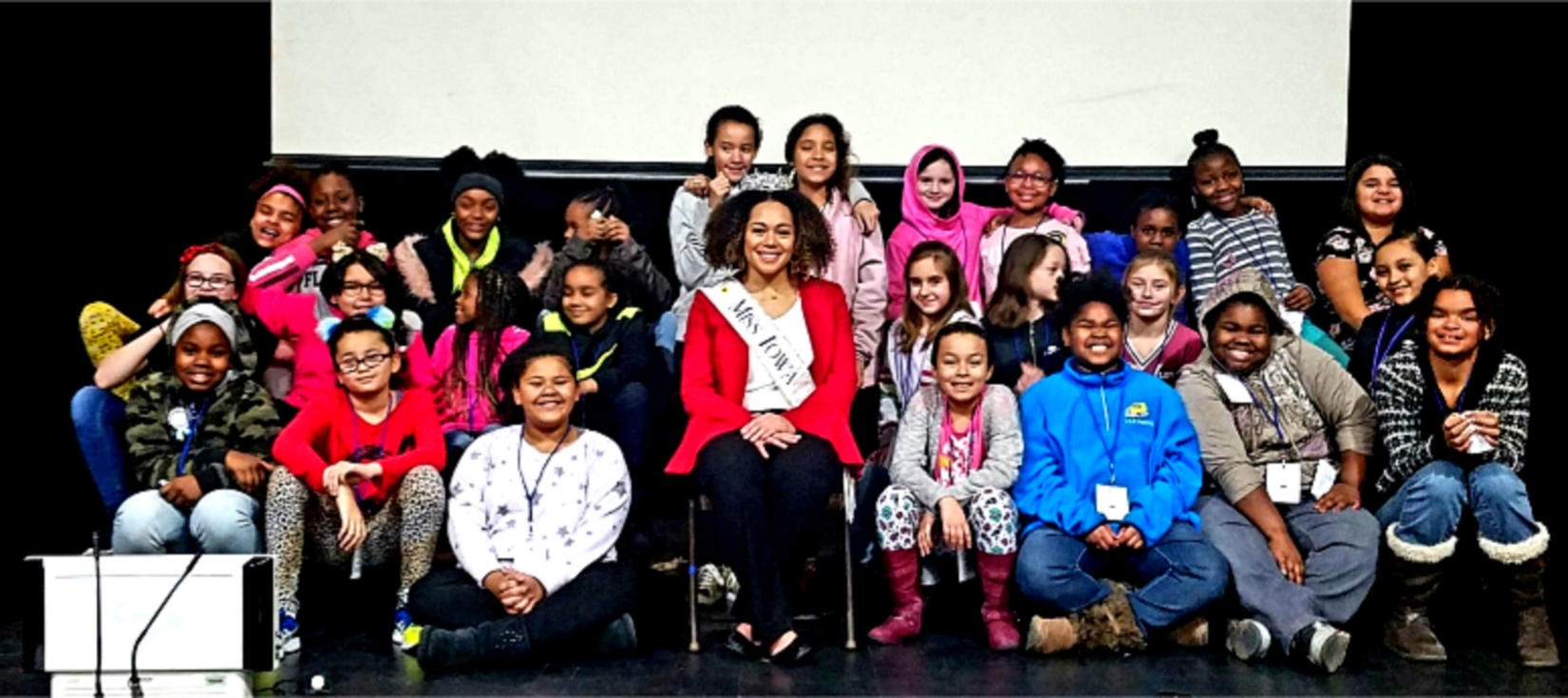 Miss Iowa 2018 posing with students at Madison Elementary School in Davenport, Iowa